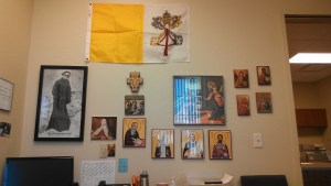 Papal Flag, JP2 picture, San Damiano Cross, Annunciation painting, the Blessed Virgin Mary, Icons of the Saints. 