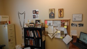 Wall rosary, St. Benedict icons, yes, that's a mini statue of JP2, BW of Chesterton, BW of C.S. Lewis, pictures of my favorite girls and my bulletin board. 