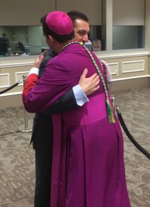 Embracing and wishing Bishop Lopes congratulations.