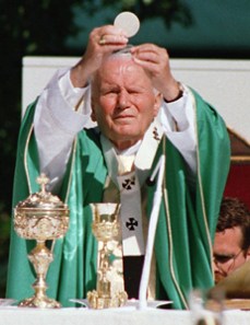 John Paul II raising Holy Eucharist