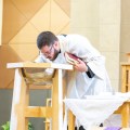 Fr. Chris breathing on the water – Baptism